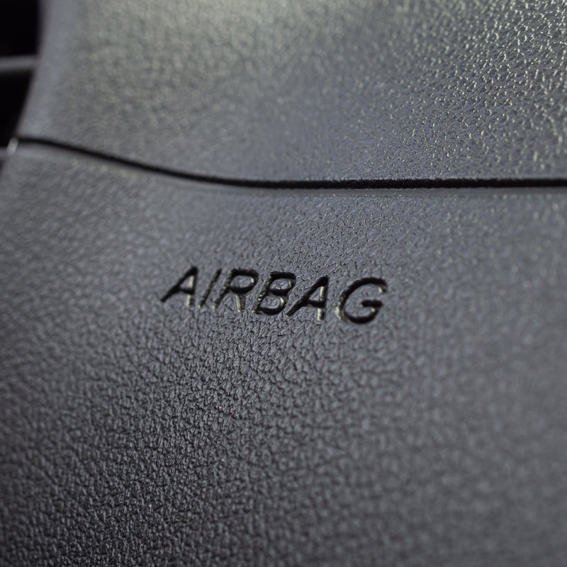 close-up of airbag marking on a car