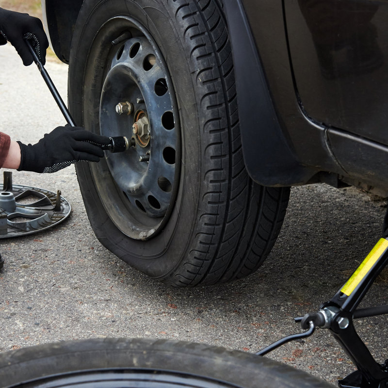 mechanic removing a tire