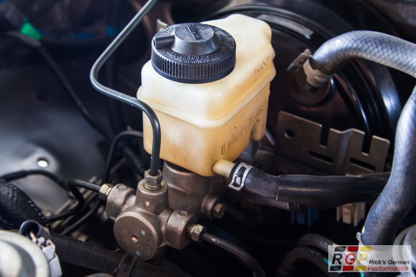 A Picture of a Brake Fluid Reservoir and Brake Master Cylinder.