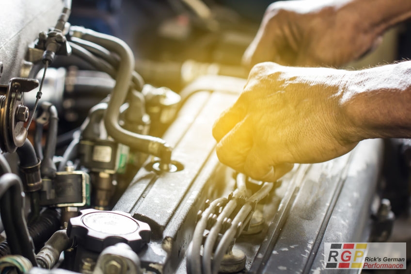 Close up mechanical man dirty hands using tool to fix repair car engine, maintenance vehicle service concept.