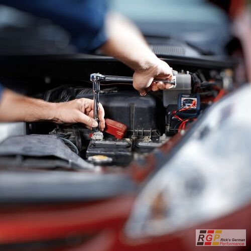 Mechanic working in auto repair garage. Car maintenance